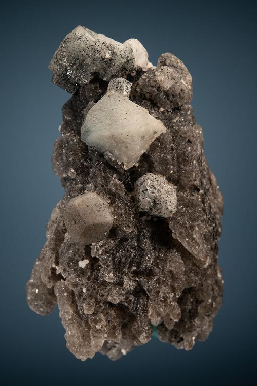 PHENAKITE with HEMATITE on QUARTZ