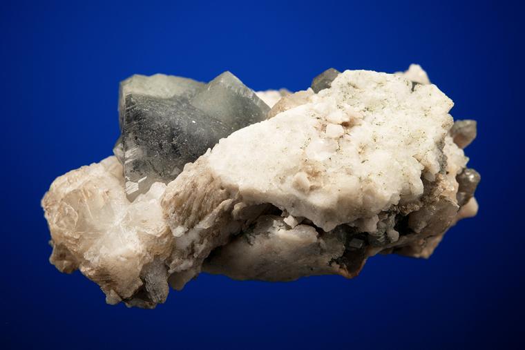 PHENAKITE on QUARTZ var. Smoky and CALCITE