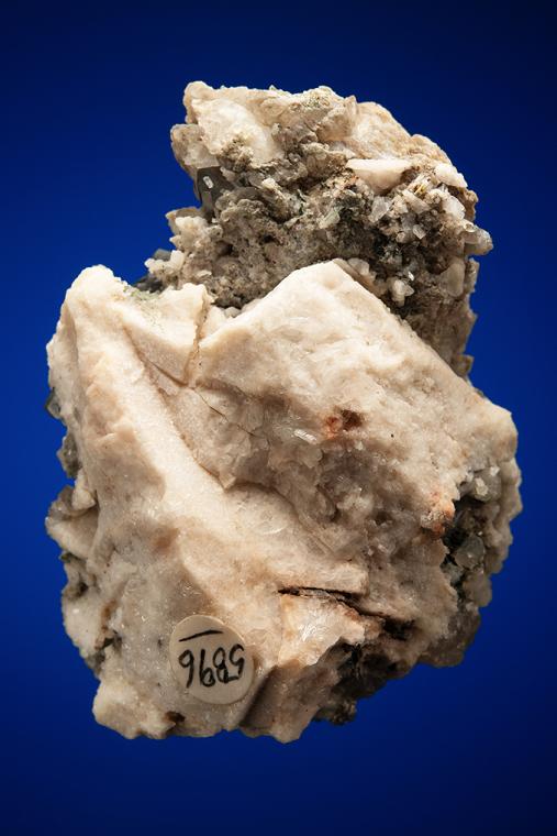 PHENAKITE on QUARTZ var. Smoky and CALCITE