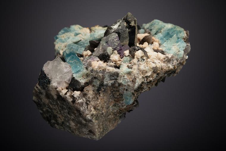 BERYL var. Aquamarine WITH QUARTZ var. Smoky, Adularia, FLUORITE and HEMATITE
