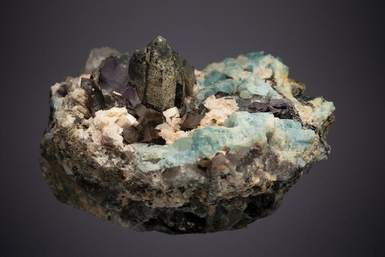 BERYL var. Aquamarine WITH QUARTZ var. Smoky, Adularia, FLUORITE and HEMATITE