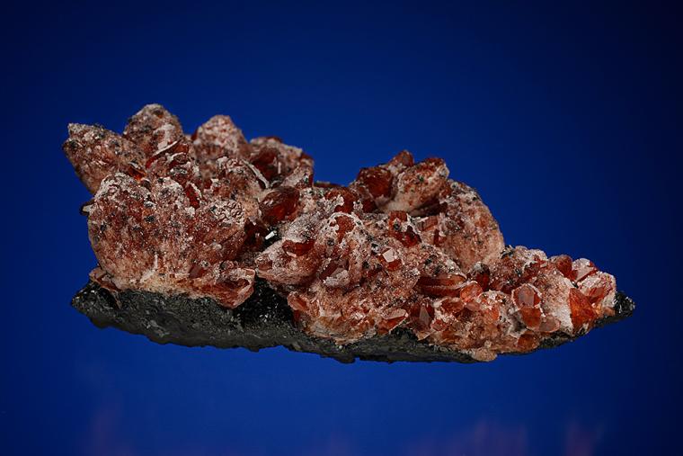 RHODOCHROSITE with QUARTZ on MANGANITE