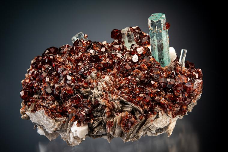 BERYL var. Aquamarine with SPESSARTINE on MICROCLINE and MUSCOVITE