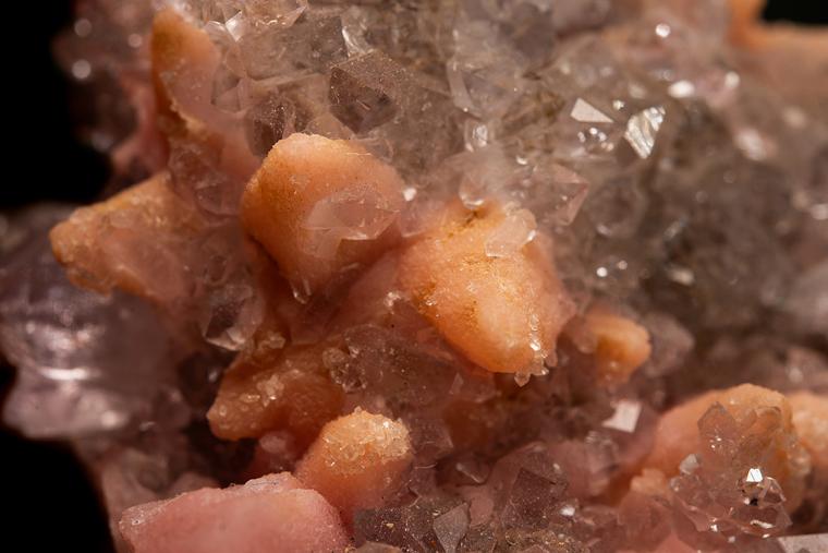 RHODOCHROSITE after CALCITE on QUARTZ var. Amethyst