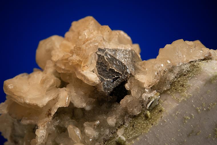 CALCITE with MUSCOVITE on ALBITE and MICROCLINE
