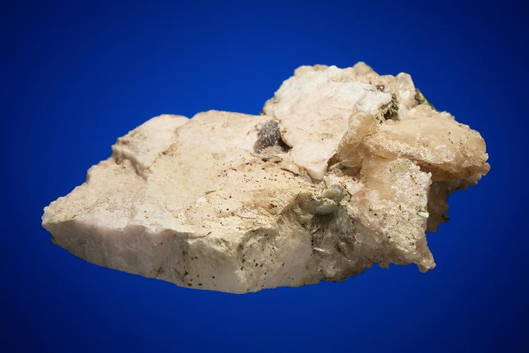 CALCITE with MUSCOVITE on ALBITE and MICROCLINE